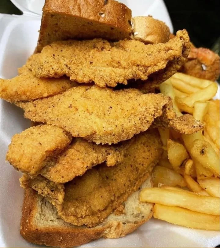 Delicious fried fish sandwich served on a bun with fresh toppings