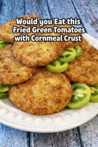 Crispy fried green tomatoes with a cornmeal crust on a serving plate