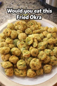 Crispy fried okra served on a plate with dipping sauce