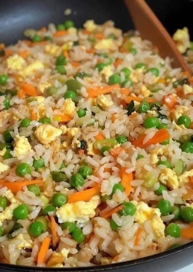 Delicious plate of fried rice with vegetables and proteins