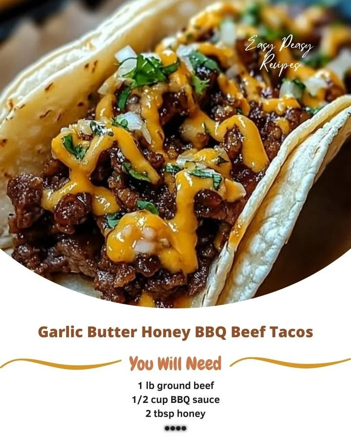 Garlic Butter Honey BBQ Beef Tacos topped with fresh herbs and served in soft tortillas.