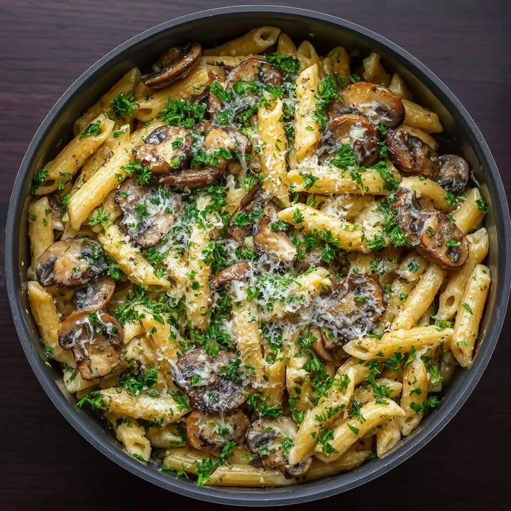 Delicious one-pot garlic butter mushroom parmesan pasta garnished with herbs