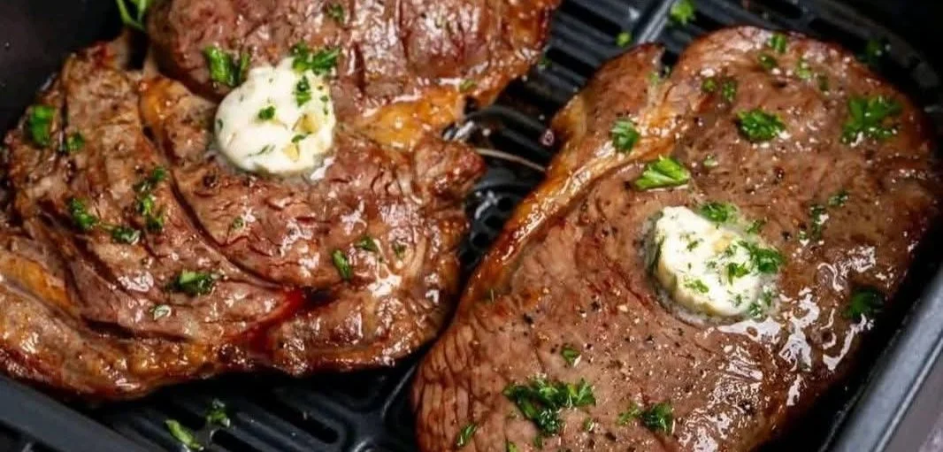 Delicious Garlic Butter Steak served with herbs and vegetables