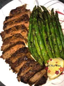Delicious Garlic Butter Steak served with fresh Asparagus