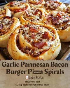 Garlic parmesan bacon burger pizza spirals topped with cheese and herbs