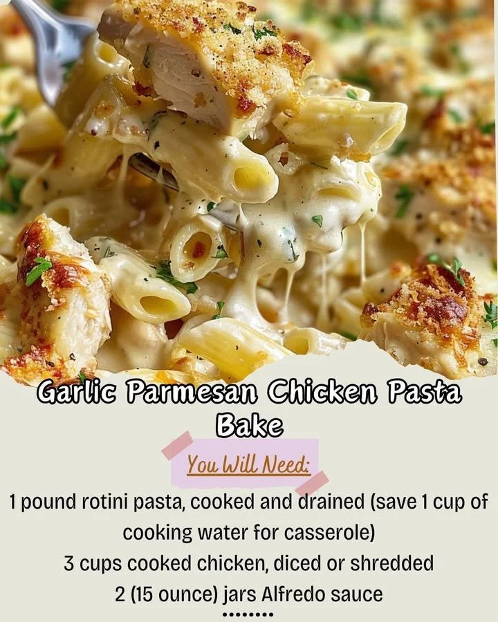 Garlic Parmesan Chicken Pasta Bake with melted cheese and herbs in a baking dish