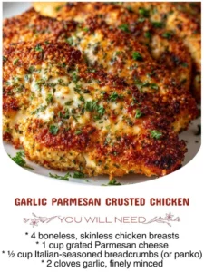 Delicious Garlic Parmesan Crusted Chicken on a plate garnished with herbs