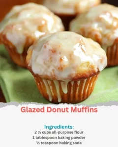 Freshly baked glazed donut muffins on a cooling rack