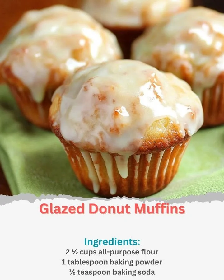 Freshly baked glazed donut muffins on a cooling rack