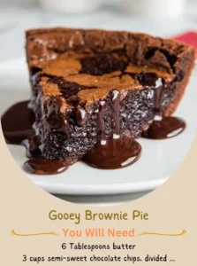 Gooey brownie pie slice topped with chocolate drizzle and nuts