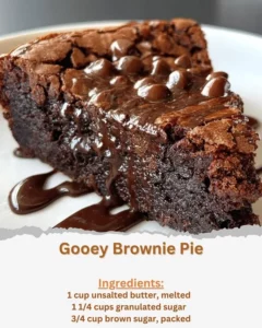 Delicious gooey brownie pie fresh out of the oven, topped with chocolate ganache.