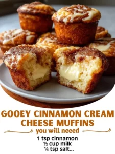 Freshly baked gooey cinnamon cream cheese muffins on a cooling rack