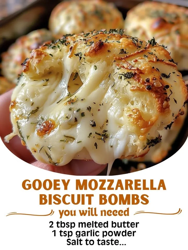 Gooey mozzarella biscuit bombs fresh out of the oven, oozing cheese.