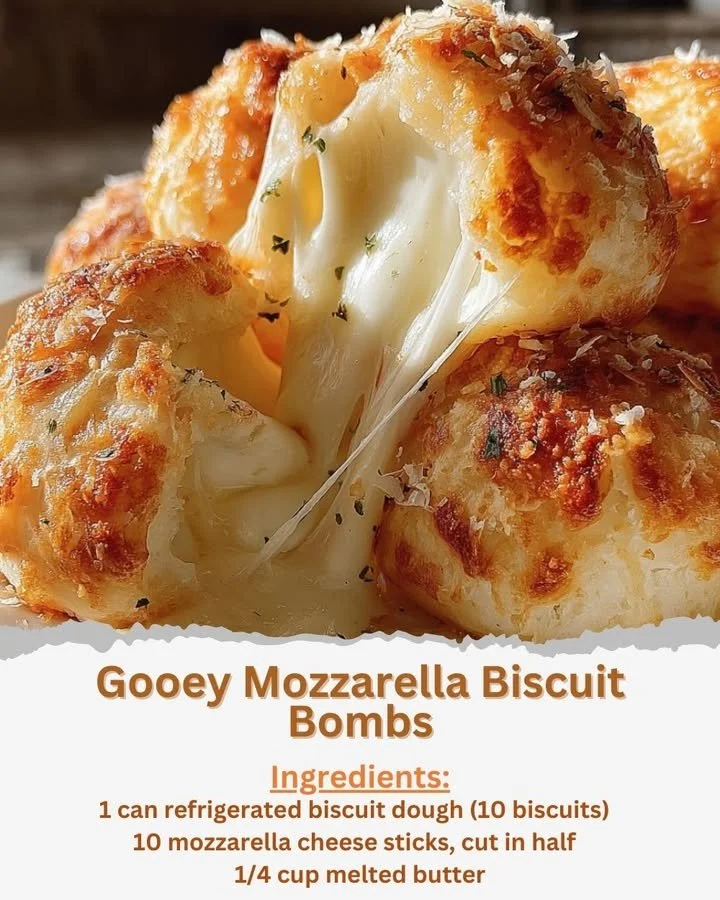 Gooey mozzarella biscuit bombs on a plate, oozing with cheese.