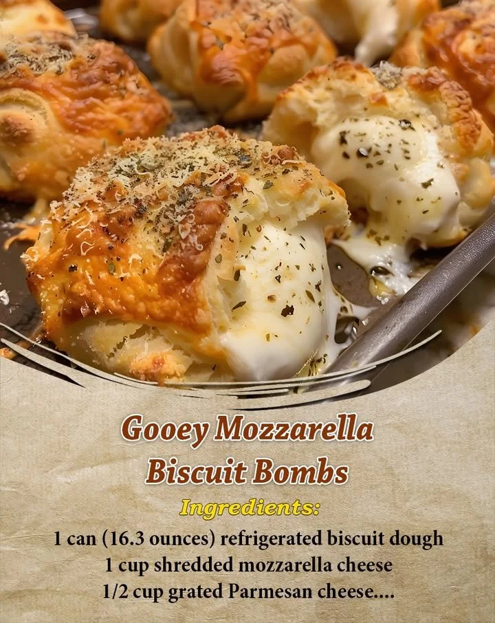 Gooey mozzarella biscuit bombs on a plate, oozing cheese and golden brown.