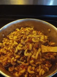 A delicious bowl of goulash, featuring tender meat and vibrant vegetables.