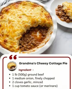 Delicious cheesy cottage pie topped with golden cheese and fresh herbs