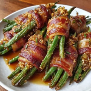 Green Bean Bundles wrapped in crispy bacon on a serving platter