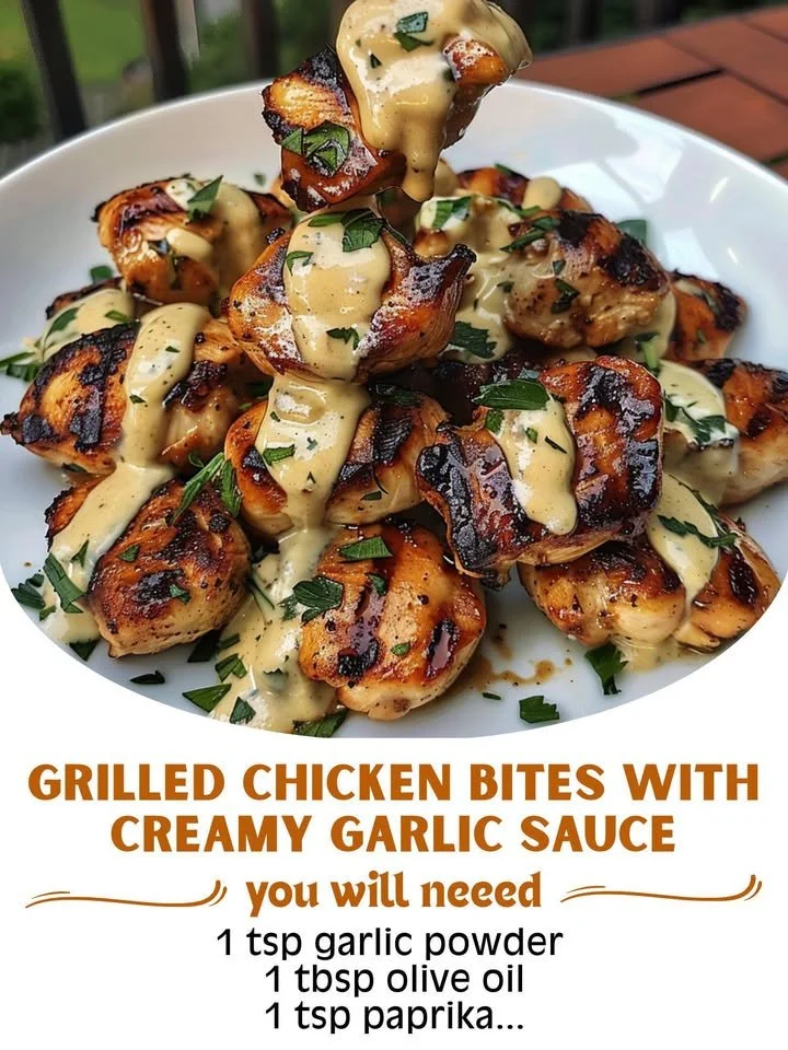 Delicious grilled chicken bites with creamy garlic sauce served on a plate