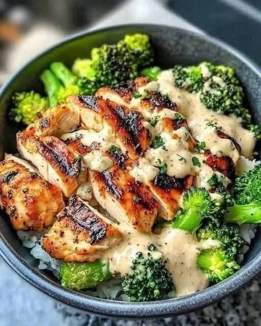 Grilled chicken and broccoli bowls with creamy garlic sauce