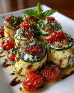 Grilled zucchini rollups filled with lemon-basil ricotta and slow roasted tomatoes