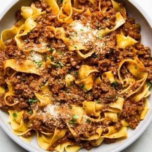 Plate of ground beef fettuccine in spicy garlic provolone cream sauce