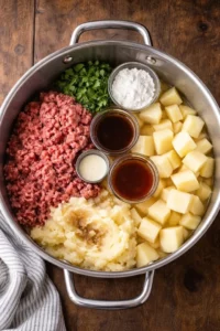 Plate of ground beef and gravy served over mashed potatoes