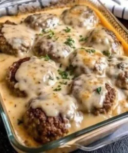 Baked hamburger steak served with gravy and vegetables in a delicious meal
