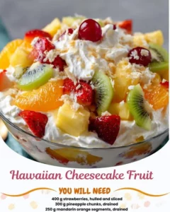 A colorful Hawaiian Cheesecake Fruit Salad with tropical fruits and creamy cheesecake layers.