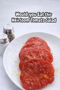 A vibrant heirloom tomato salad with fresh ingredients and colorful presentation