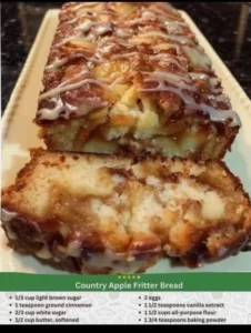 Slice of homemade apple cinnamon swirl loaf on a wooden table