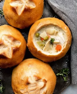Freshly baked homemade bread bowls filled with soup
