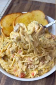 Plate of homemade chicken spaghetti with chicken, pasta, and sauce