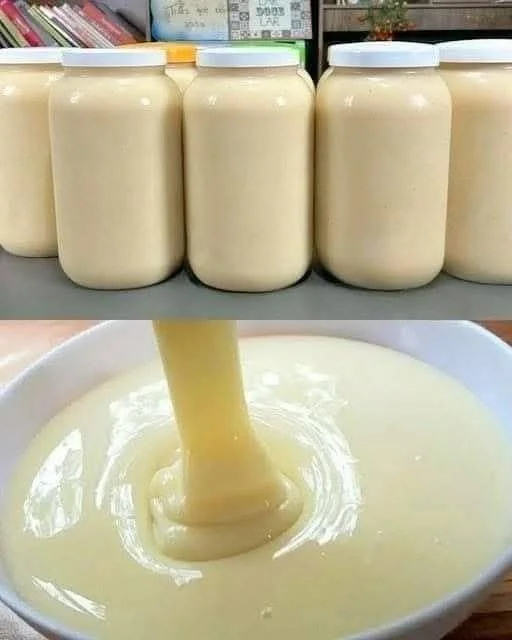 Jar of homemade condensed milk on a kitchen counter