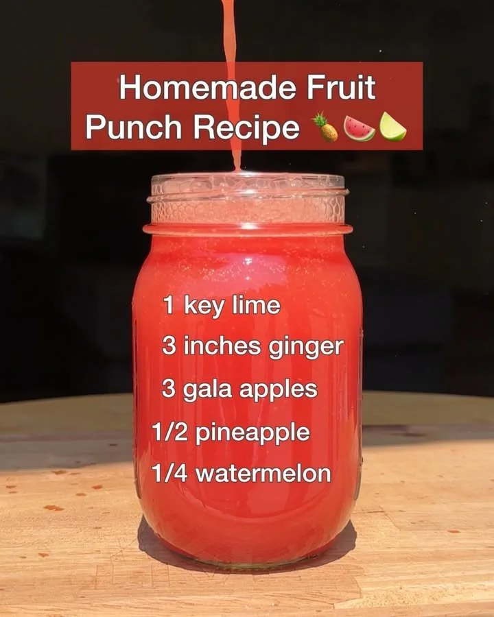 A refreshing bowl of homemade fruit punch with colorful mixed fruits.