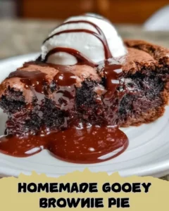 Delicious homemade gooey brownie pie with a glossy chocolate topping