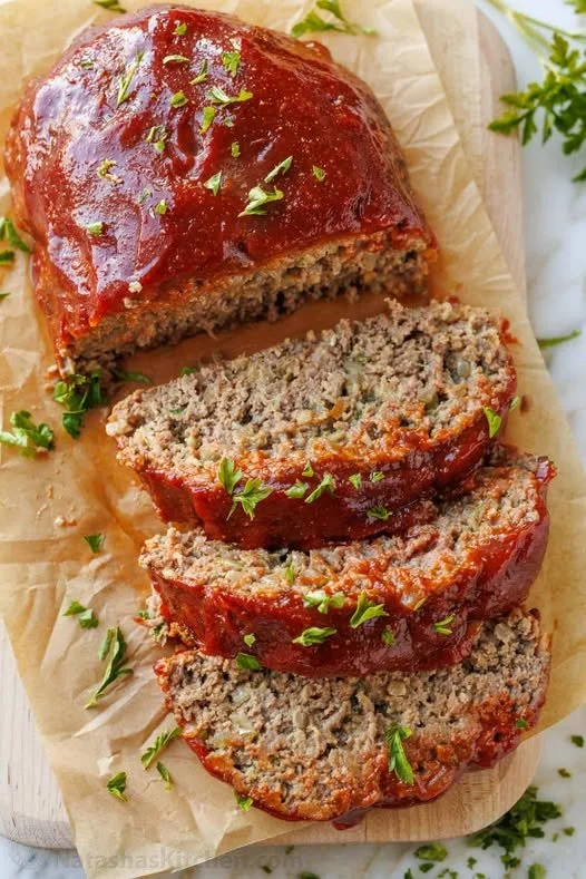Homemade meatloaf served with mashed potatoes and green beans
