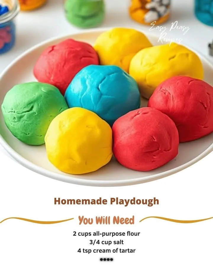 Homemade playdough in various colors and shapes for kids' crafts.
