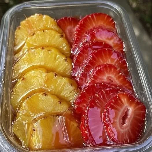 Colorful homemade strawberries and pineapple candy on a plate