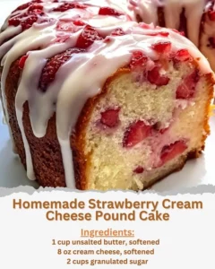 Homemade strawberry cream cheese pound cake freshly baked and garnished with strawberries