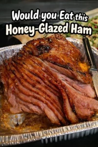 A beautifully presented honey-glazed ham ready for a festive meal.