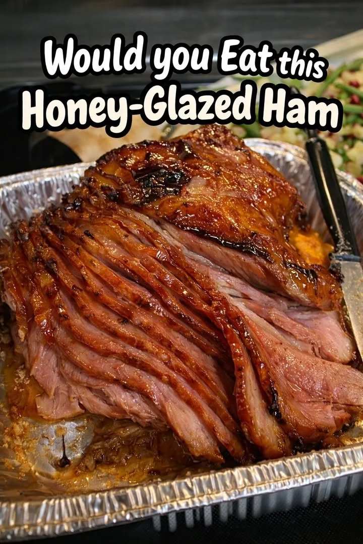 A beautifully presented honey-glazed ham ready for a festive meal.