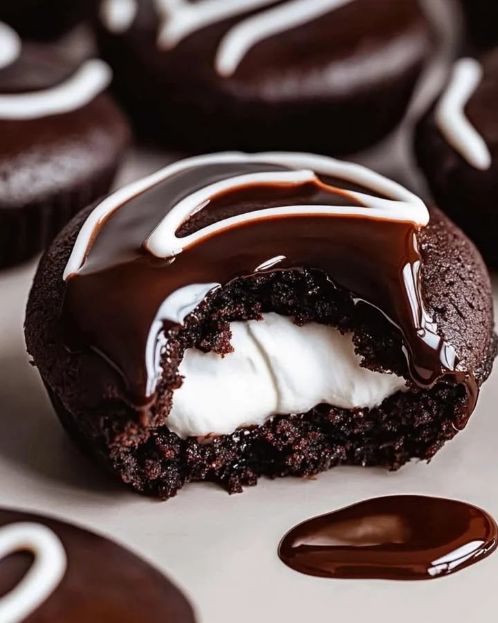 A plate of homemade Hostess Cupcake Cookies with chocolate frosting.