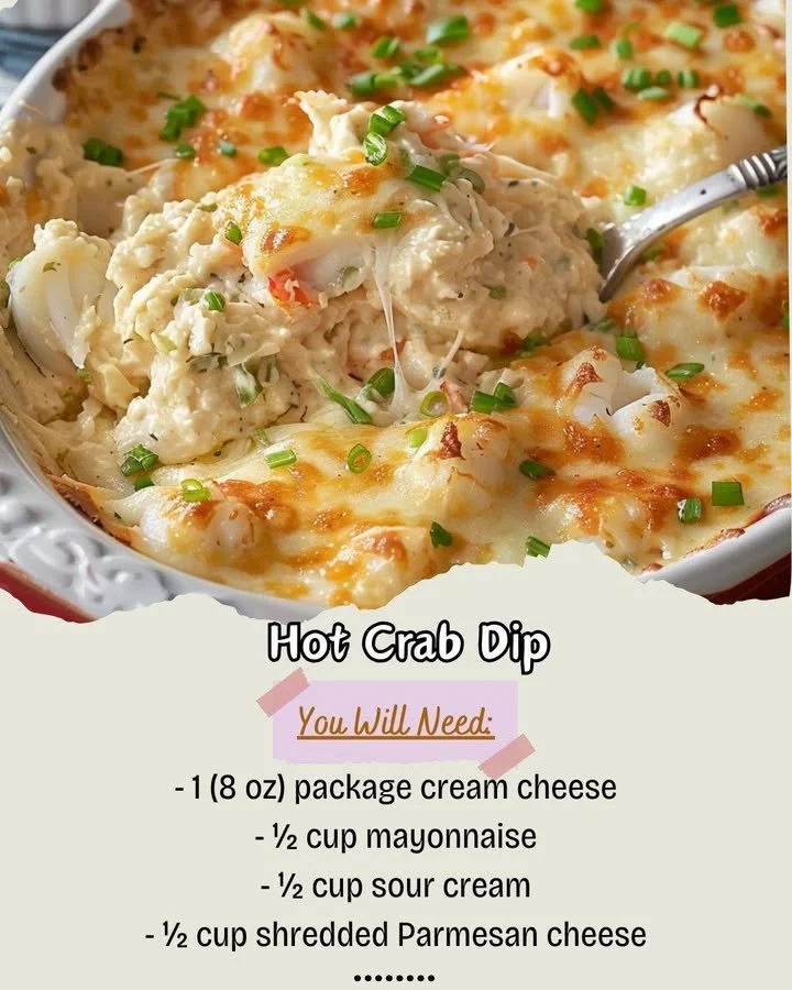 Delicious hot crab dip served in a bowl with toppings and crackers.