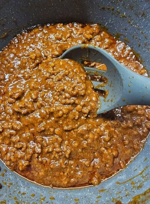 Delicious hot dog chili sauce served alongside grilled hot dogs