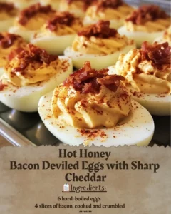 Hot Honey Bacon Deviled Eggs topped with Sharp Cheddar cheese
