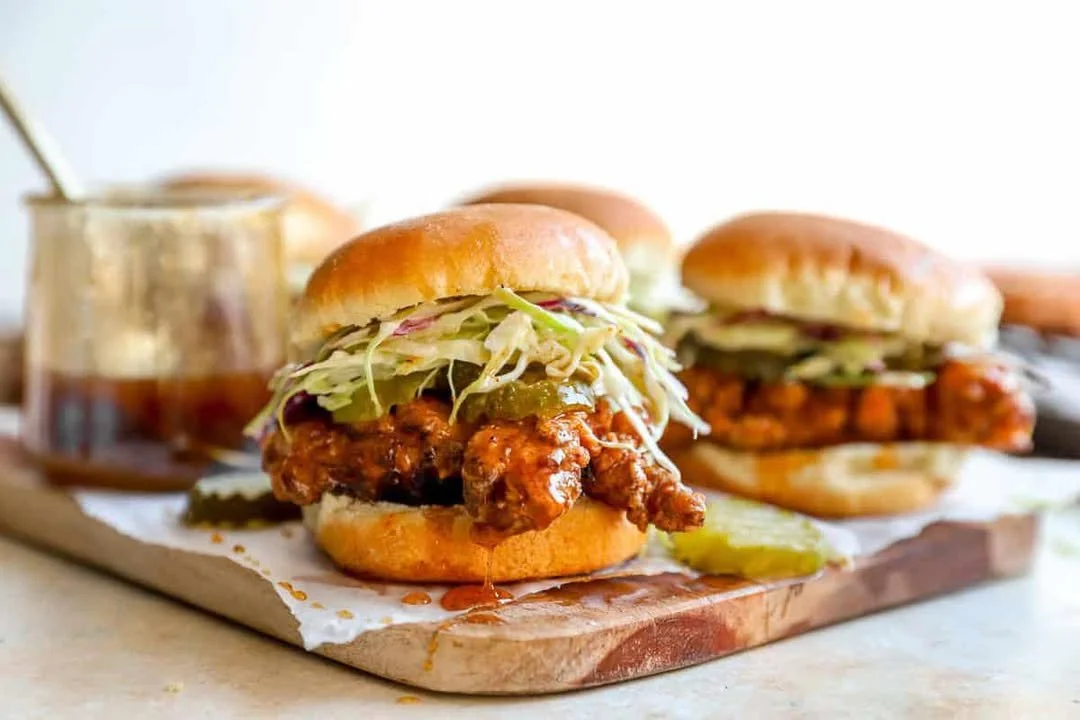Delicious hot honey chicken sliders served with fresh ingredients