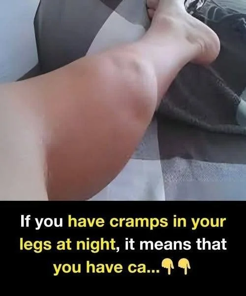 Person experiencing leg cramps at night, seeking relief and understanding.