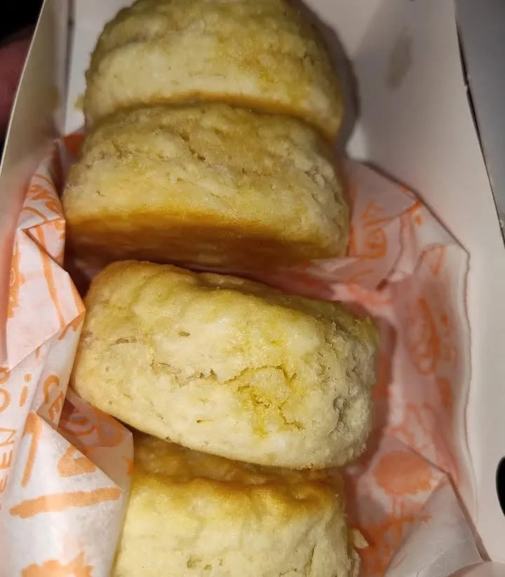 Delicious Popeyes biscuit with peanut butter spread on top.