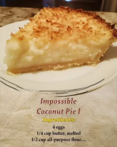 Delicious Impossible Coconut Pie topped with coconut flakes and served in a slice.